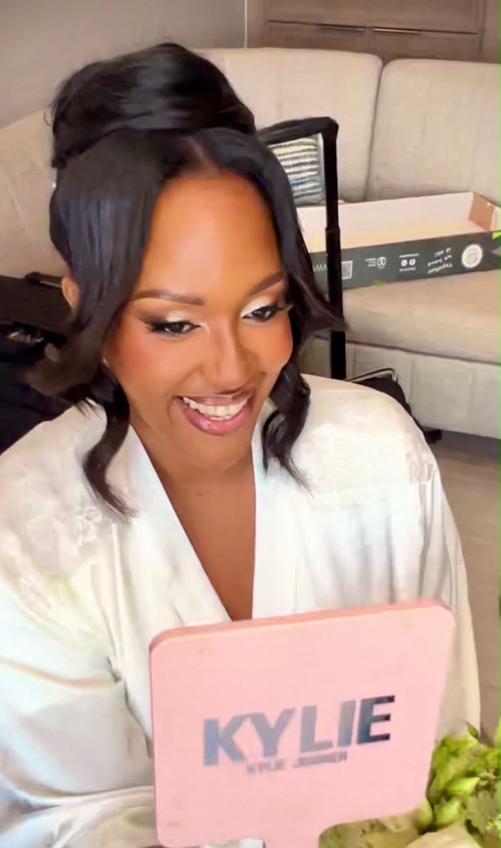 Glamorous half-up style with soft curls for a bride getting ready
