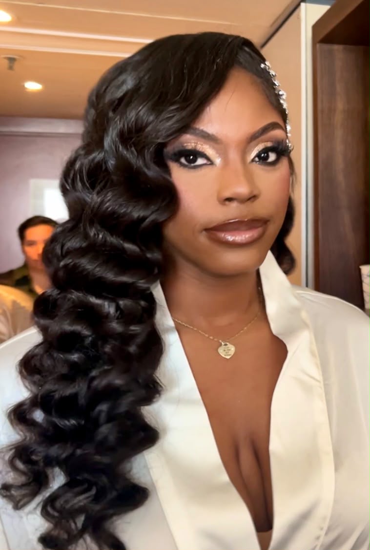 Deep glossy Hollywood waves swept to one side